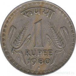 Монета. Индия. 1 рупия 1980 год. Гурт - рубчатый с желобом.