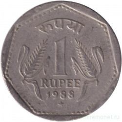Монета. Индия. 1 рупия 1988 год. "*" - Хайдарабад, гурт - рубчатый с желобом.