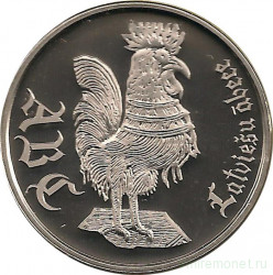 Монета. Латвия. 1 лат 2010 год. Латышская азбука (петух) в буклете.