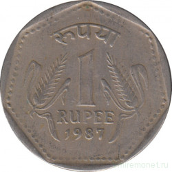 Монета. Индия. 1 рупия 1987 год. Гурт - рубчатый с желобом.