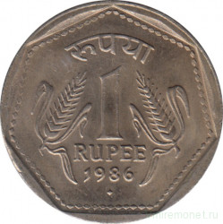 Монета. Индия. 1 рупия 1986 год. Гурт - рубчатый с желобом.