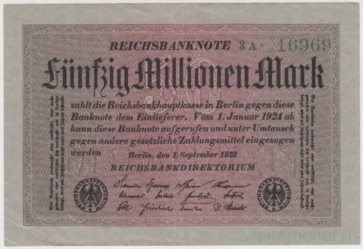 Банкнота. Германия. Веймарская республика. 50 миллионов марок 1923 год. Серый фон. Водяной знак - четырёхлистник. Серийный номер - цифра, буква, точка, пять цифр (крупные,зелёные).